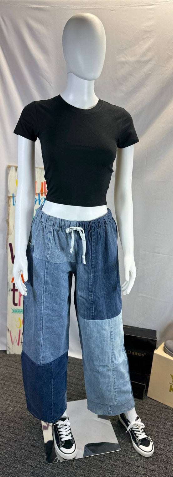 Pair of American Recycled Clothing denim eco jeans showing classic five-pocket design and straight-leg fit.