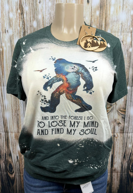 Nwdesigns3 Sasquatch "Into the Forest I Go" humorous graphic t-shirt featuring a Bigfoot silhouette in a forest setting