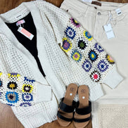 Colorful multi-pattern cardigan by ADORA LA featuring a cozy knit fabric and diverse geometric and floral designs.