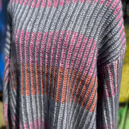 Shopin LA brand. Soft grey ribbed sweater with pink, grey and orange stripes and loose sleeves. 100% polyester. S, M, L $27