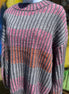 Shopin LA brand. Soft grey ribbed sweater with pink, grey and orange stripes and loose sleeves. 100% polyester. S, M, L $27