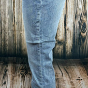 Light-wash Judy Blue Boyfriend jeans with relaxed fit and distressed details, showcasing casual denim style and classic five-pocket design.