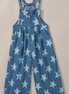 Aapparella star print button strap denim overalls featuring adjustable straps and front pockets on a light blue denim background.