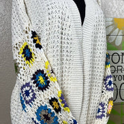 ADORA LA multi-pattern cardigan featuring various colorful knit designs, long sleeves, and a cozy, stylish fit.