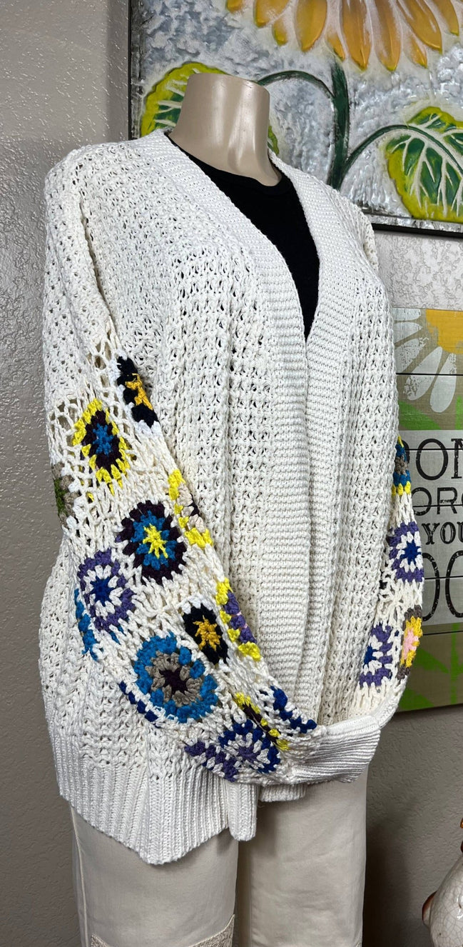 ADORA LA multi-pattern cardigan featuring various colorful knit designs, long sleeves, and a cozy, stylish fit.