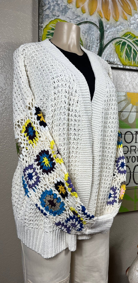ADORA LA multi-pattern cardigan featuring various colorful knit designs, long sleeves, and a cozy, stylish fit.