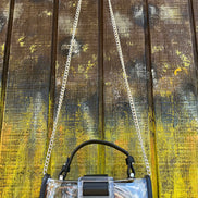 Translucent buckle purse by Miss Sparkling showing clear plastic material with a silver buckle closure and compact design.