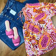 ADORA LA peasant floral top with long sleeves, featuring a colorful floral pattern and a relaxed, bohemian style.