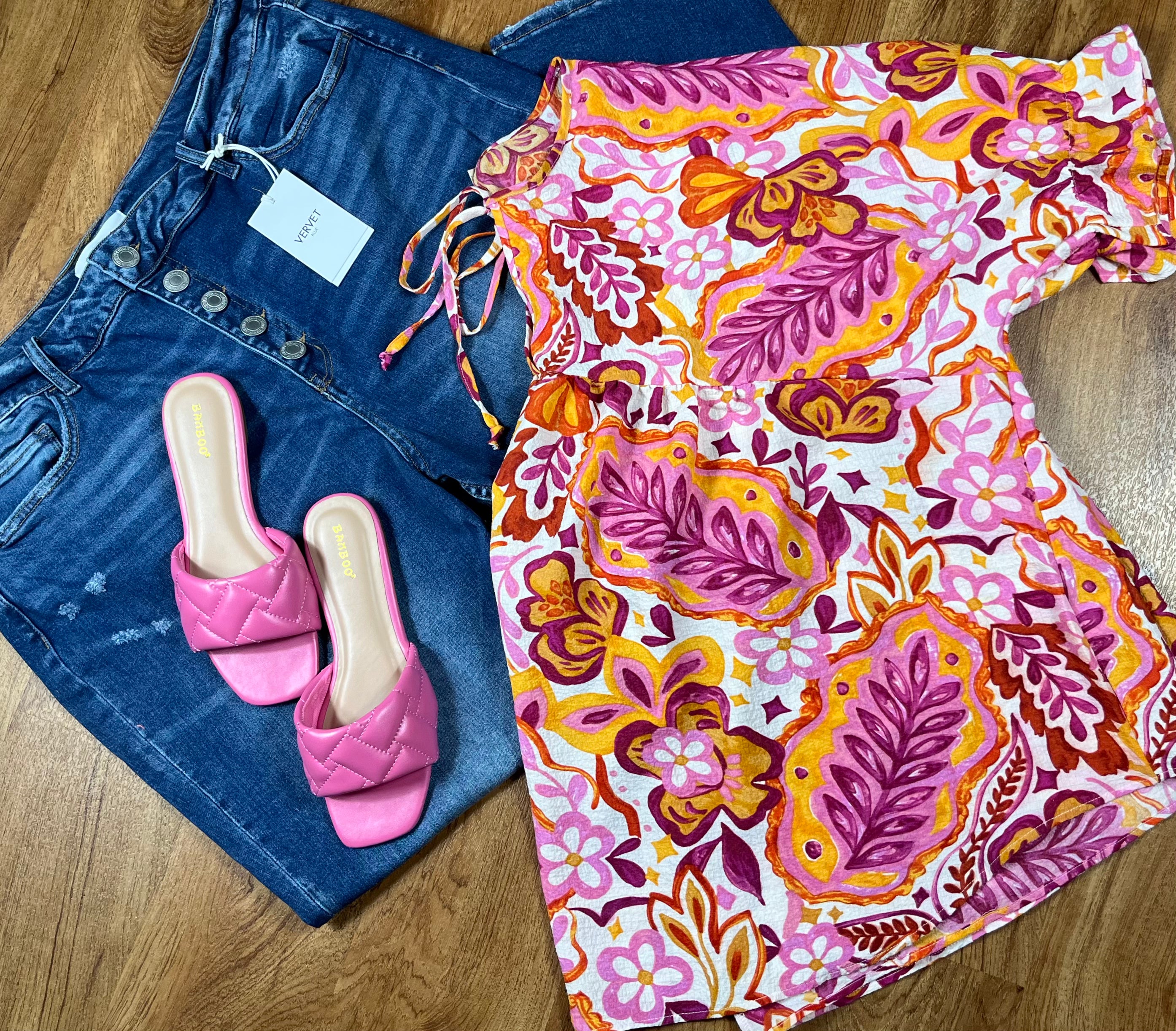 ADORA LA peasant floral top with long sleeves, featuring a colorful floral pattern and a relaxed, bohemian style.