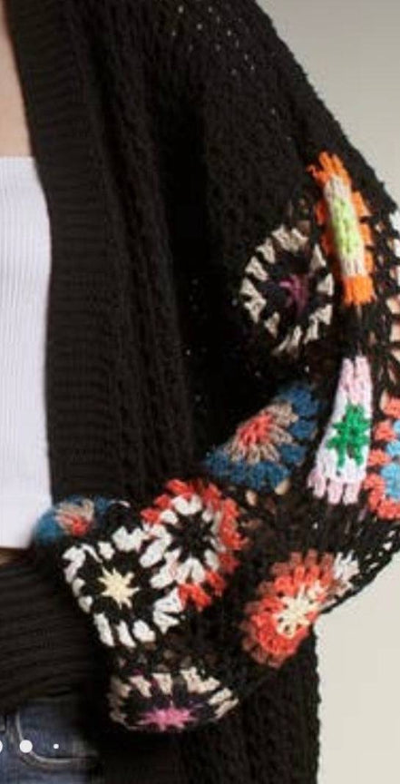 Multicolor patterned cardigan by ADORA LA featuring a cozy knit design and versatile style for casual wear.