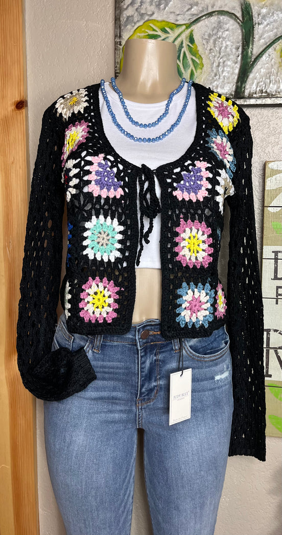 ADORA LA front tie crocheted cardigan shown in a full-length view with intricate crochet pattern and tie-front design.