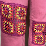 Judy Blue wide-leg jeans with crocheted patch details, full-length, showcasing trendy denim style and relaxed fit.