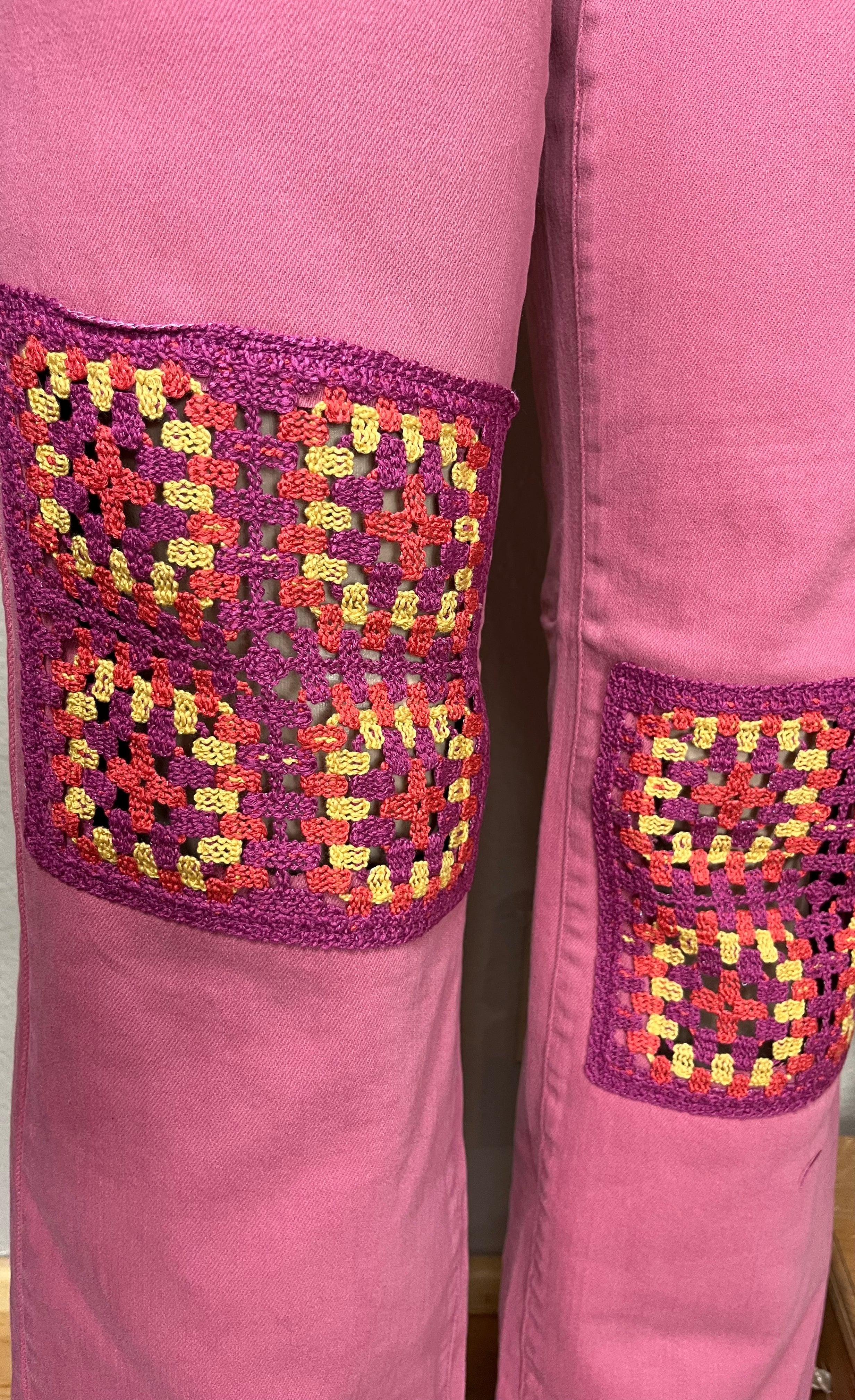 Judy Blue wide-leg jeans with crocheted patch details, full-length, showcasing trendy denim style and relaxed fit.