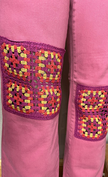 Judy Blue wide-leg jeans with crocheted patch details, full-length, showcasing trendy denim style and relaxed fit.