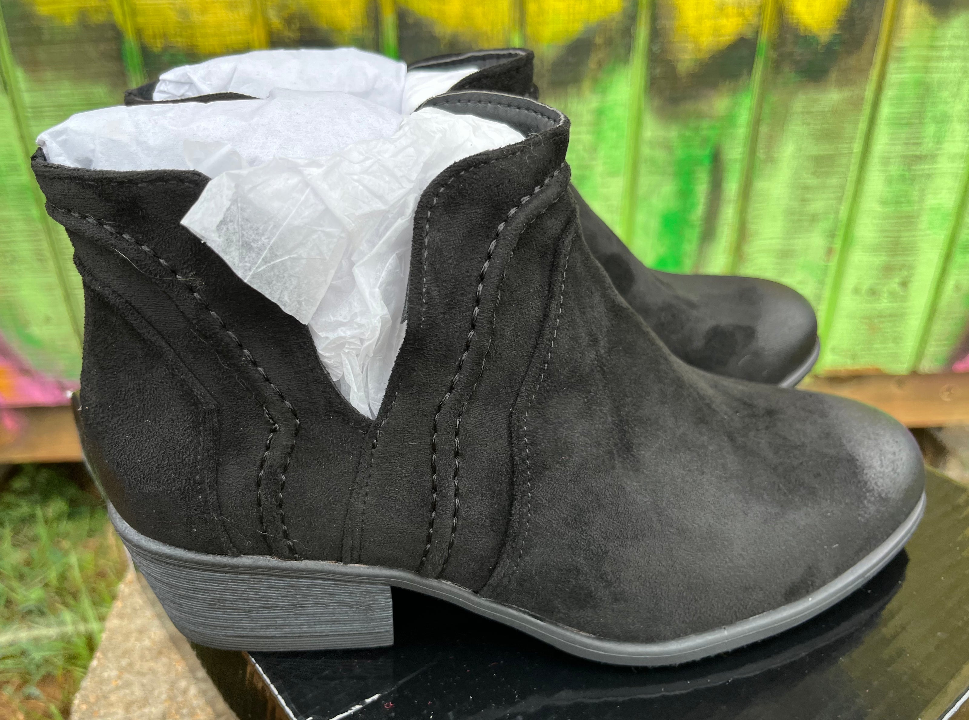 Pierre Dumas ankle boots with stylish leather design and low heel, displayed on a neutral background.