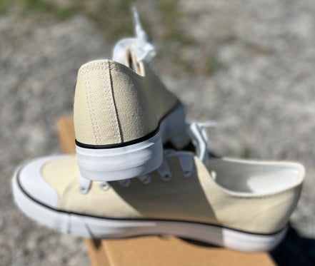 Pair of classic FASHION EMPORIO sneakers in white with laces, showcasing a casual and stylish footwear option.