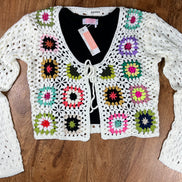 ADORA LA front tie crocheted cardigan showing intricate knit pattern and tie closure, perfect for a stylish layered look.