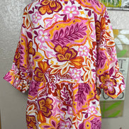 ADORA LA peasant floral top featuring a lightweight, bohemian-inspired design with colorful floral patterns and relaxed fit.