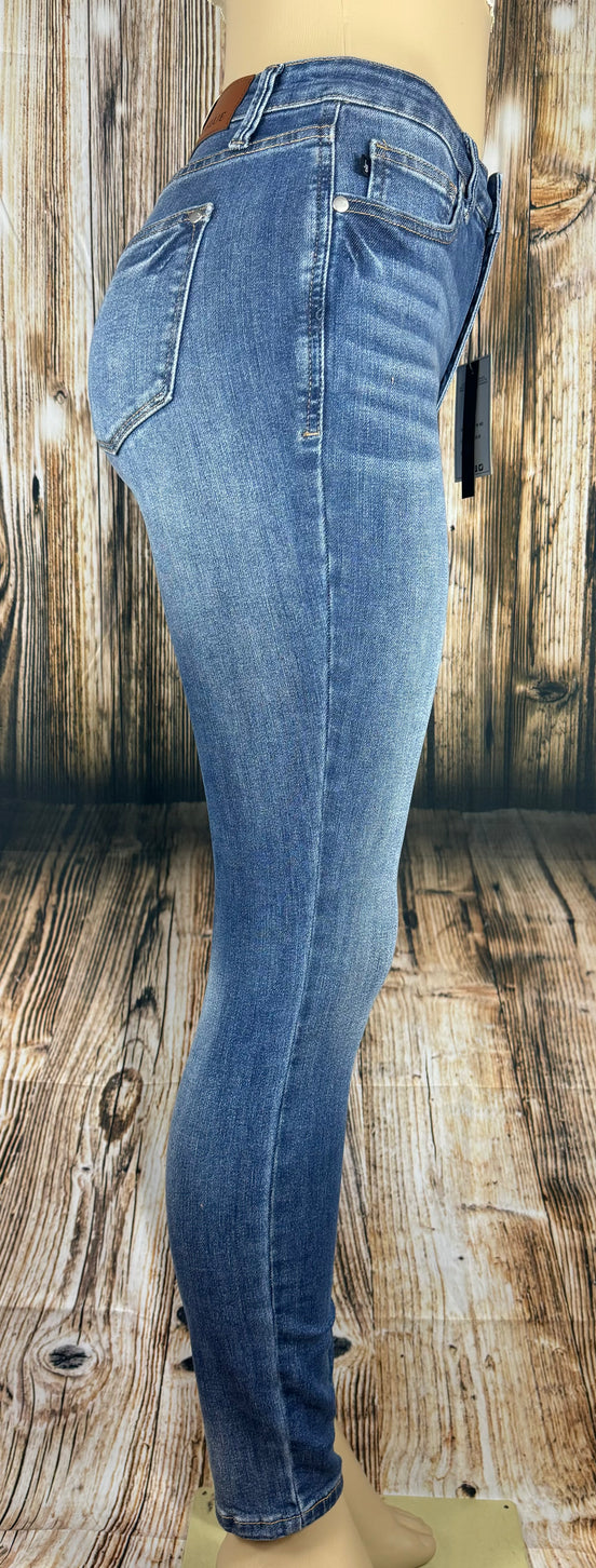 Judy Blue Classic Skinny jeans shown full length, featuring a dark wash, mid-rise fit, and slim-leg style on a model.