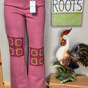 Judy Blue wide-leg jeans with crocheted patch details and a relaxed fit, showcasing the stylish denim design.