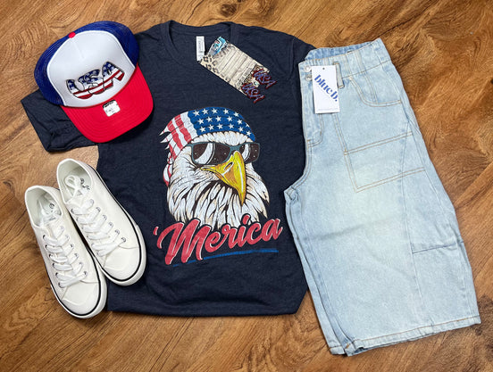 Red, white, and blue patriotic T-shirt from Southern Attitude Designs Inc featuring American flag and "Merica" slogan.