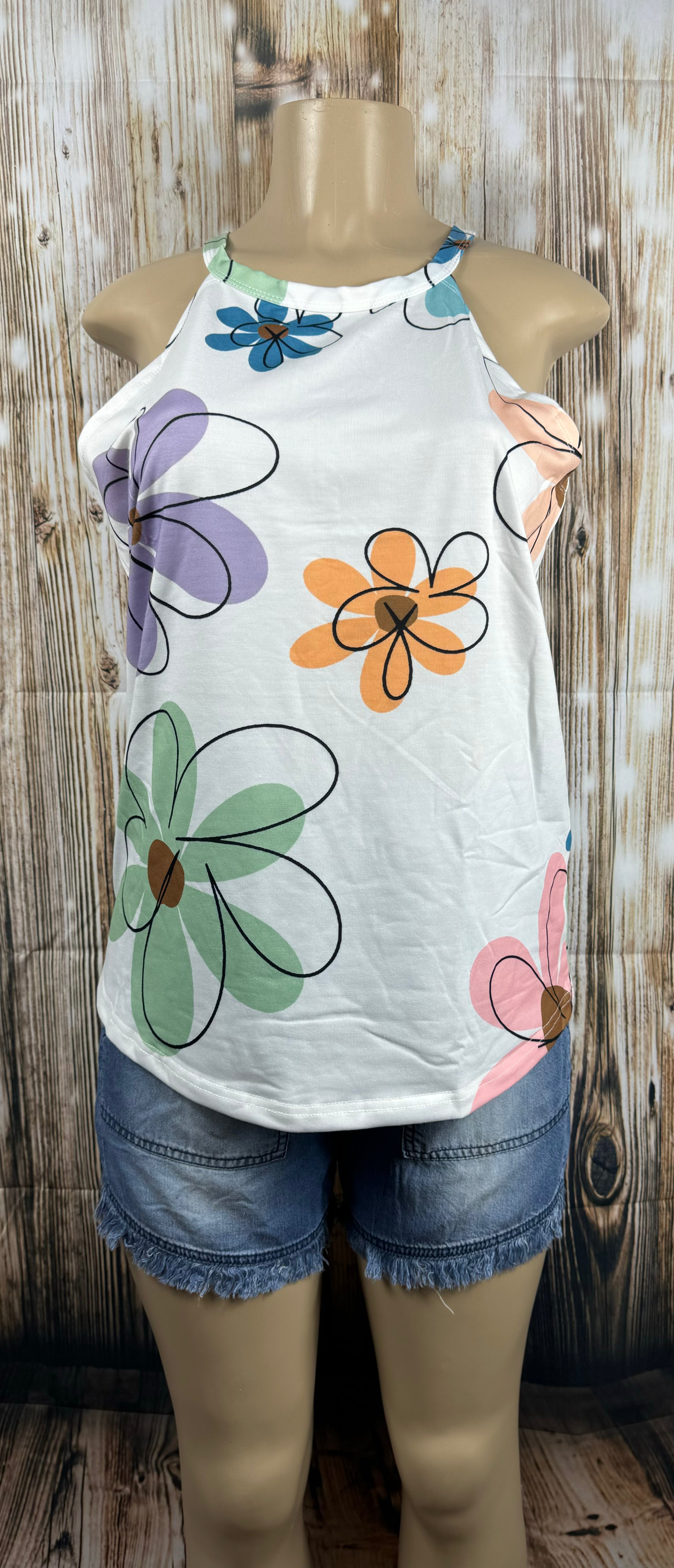 Aapparella big floral print sleeveless tank top displayed flat, showcasing vibrant colorful floral design and sleeveless style.