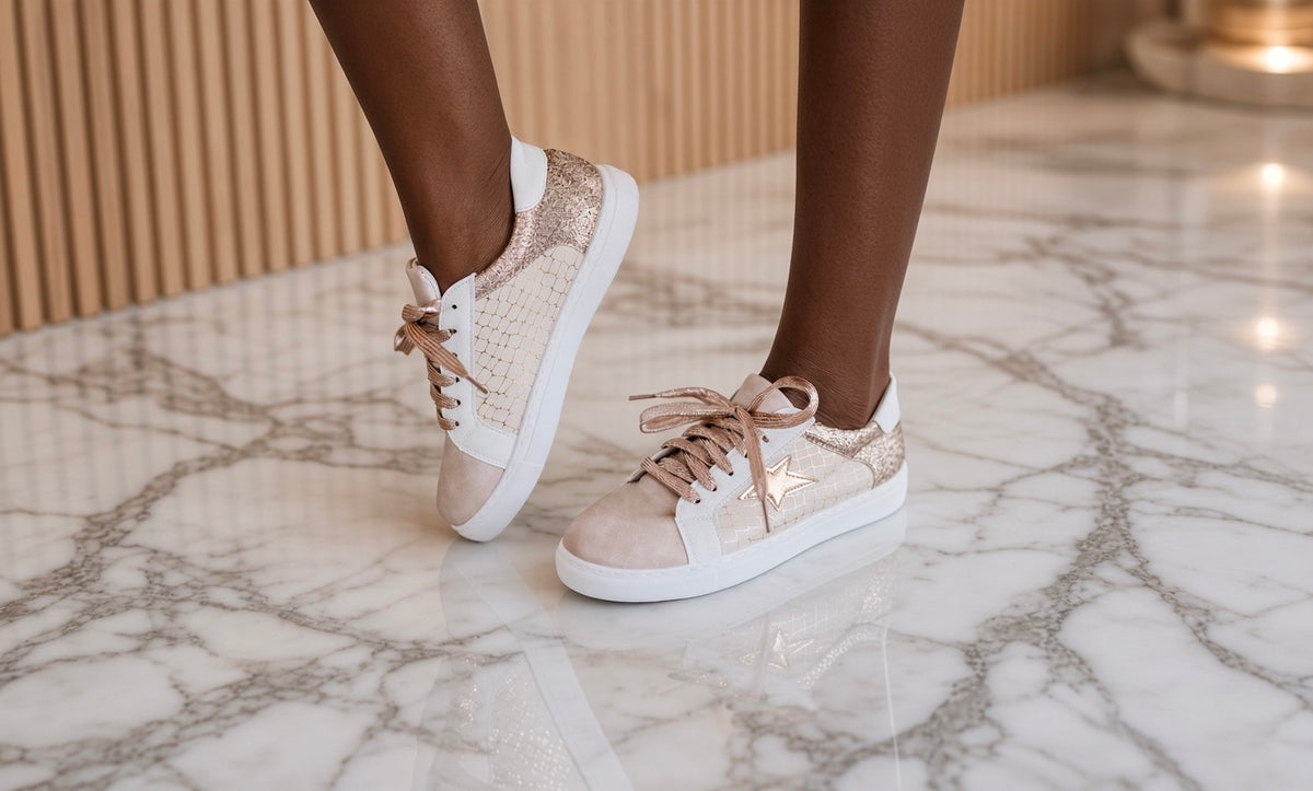 Liam & Company patchwork sneakers showing colorful, multi-patterned fabric shoes with white soles and laces.