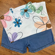 Aapparella sleeveless tank top with large floral print, vibrant colors, and a relaxed fit, perfect for casual summer wear.