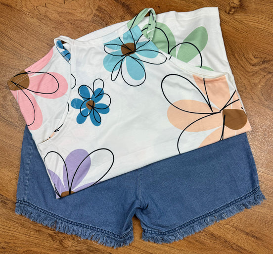 Aapparella sleeveless tank top with large floral print, vibrant colors, and a relaxed fit, perfect for casual summer wear.