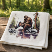 Brightly colored Bathing Bigfoot 3-piece towel set by Squatchin’ Country featuring Bigfoot designs on soft cotton towels.