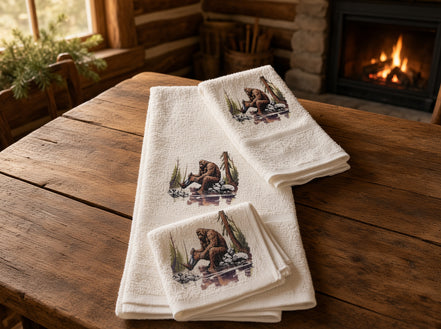 Squatchin’ Country Bathing Bigfoot 3-piece towel set with Bigfoot footprint and playful design for novelty bathroom decor.