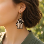 Hand-painted raccoon earrings made of lightweight maple wood by Seasideblooms, featuring detailed animal design and natural wood finish.
