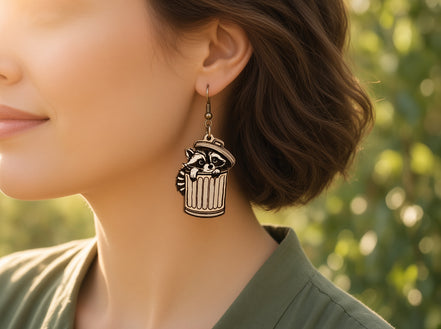 Hand-painted raccoon earrings made of lightweight maple wood by Seasideblooms, featuring detailed animal design and natural wood finish.