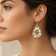 Metal sun earrings by Anju Jewelry featuring circular sun design with textured finish, perfect for boho or casual style.