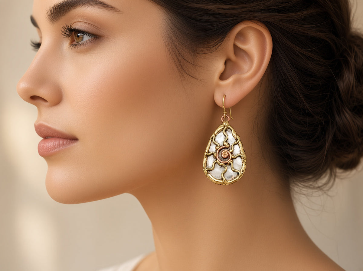 Metal sun earrings by Anju Jewelry featuring circular sun design with textured finish, perfect for boho or casual style.