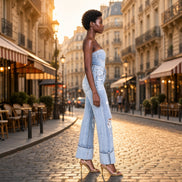 A pair of Aapparella distressed straight leg flare jeans with ripped details and frayed hem, styled for casual wear.