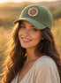 Corduroy cap with sunflower leather patch, trendy accessory featuring a stylish design and adjustable fit.