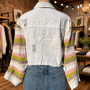 Bellissima Fashion denim patchwork jacket, stylish outerwear with mixed denim patches, displayed on a hanger.