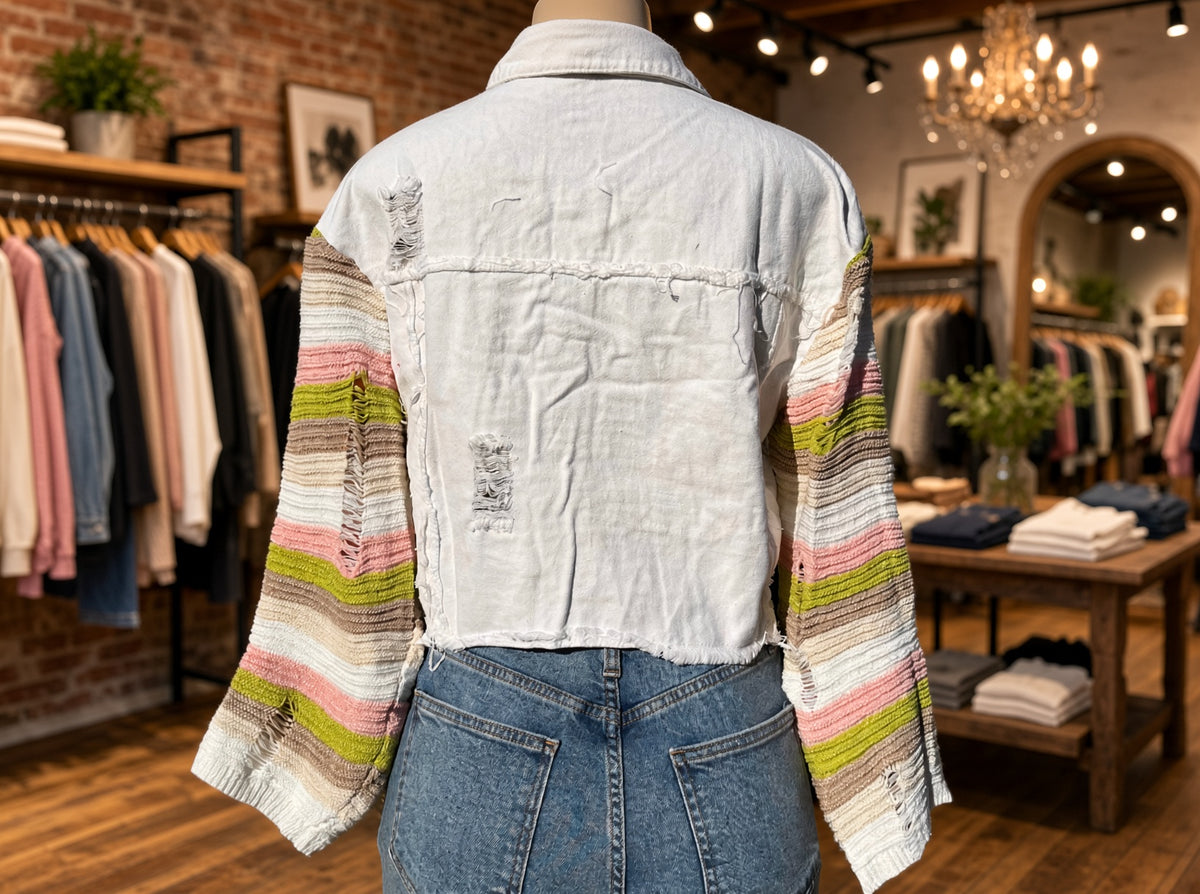Bellissima Fashion denim patchwork jacket, stylish outerwear with mixed denim patches, displayed on a hanger.