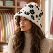 Hana floral faux fur bucket hat with a colorful floral pattern, soft faux fur material, stylish accessories for fashion-forward looks.