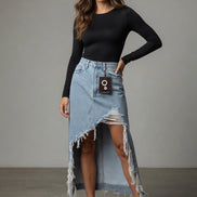 Distressed denim maxi skirt by Insane Gene USA featuring a high-waisted design and frayed hem, displayed on a hanger.