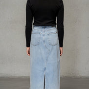 Distressed denim maxi skirt from Insane Gene USA featuring a casual, ripped design and a flowing silhouette.