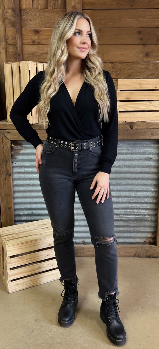Black skinny jeans by VERVET by FLYING MONKEY with a close-up of the denim fabric and front pockets.
