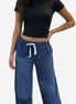American Recycled Clothing denim eco jeans showing a relaxed fit and classic five-pocket design on a model.