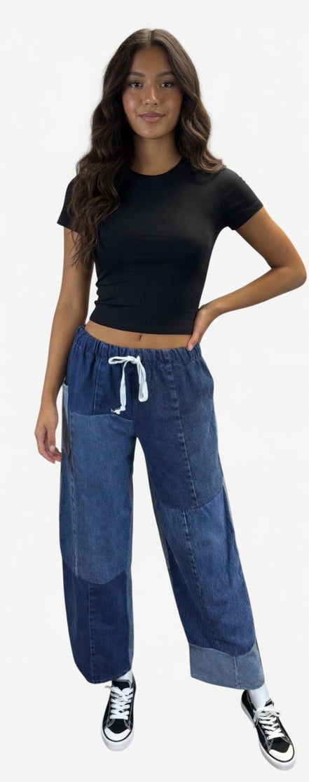 American Recycled Clothing denim eco jeans showing a relaxed fit and classic five-pocket design on a model.