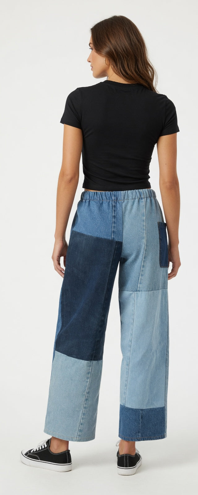 Pair of American Recycled Clothing denim eco jeans showing classic fit and medium wash fabric with visible stitching.
