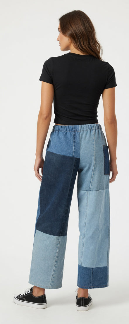 Pair of American Recycled Clothing denim eco jeans showing classic fit and medium wash fabric with visible stitching.