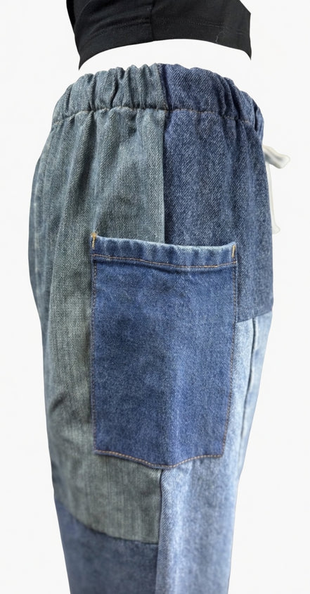 Pair of American Recycled Clothing denim eco jeans showing classic five-pocket style and straight-leg fit.