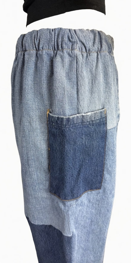 Pair of American Recycled Clothing denim eco jeans showing classic fit, five-pocket design, and medium wash fabric.