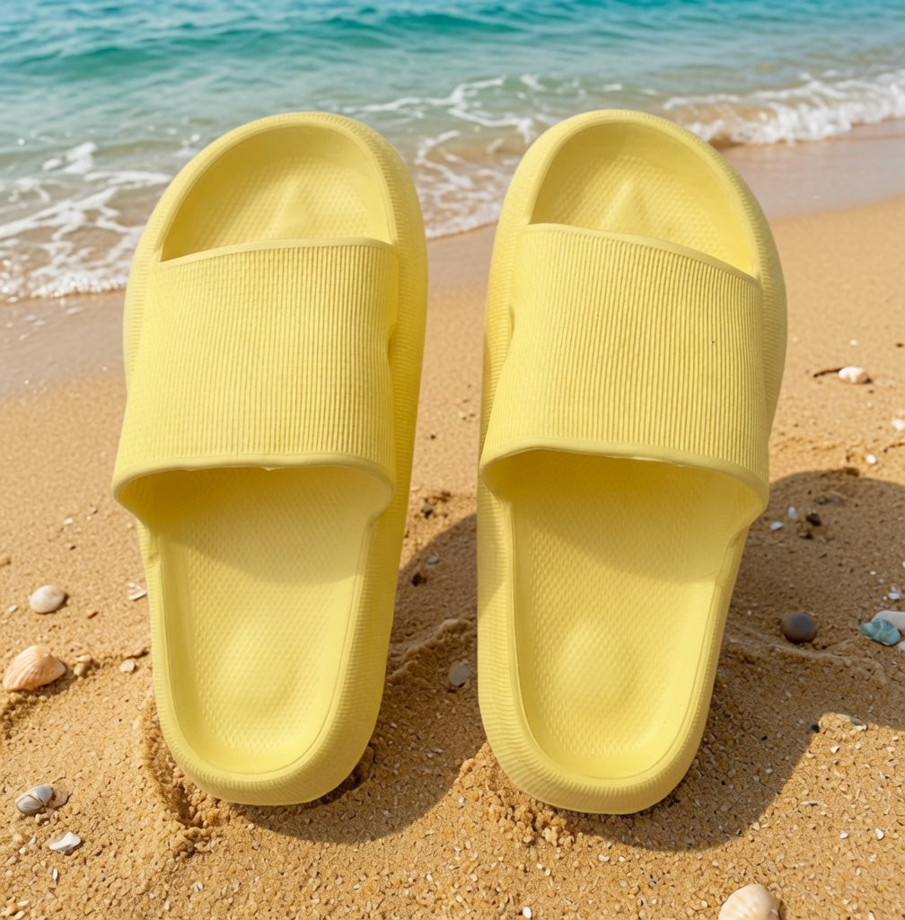 Yellow rubber platform slides shoes from Shop Lev, featuring thick soles and open-toe design for casual summer wear.